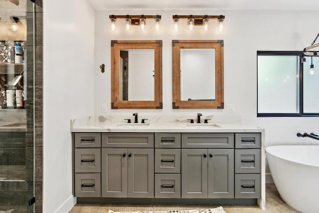 bathroom with vanity and independent shower and bath