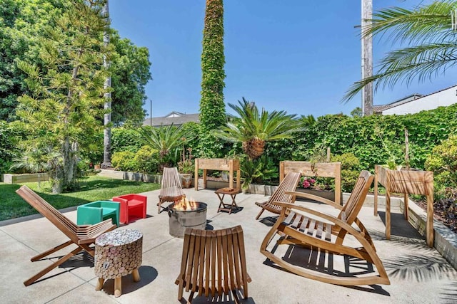 view of patio / terrace featuring a fire pit