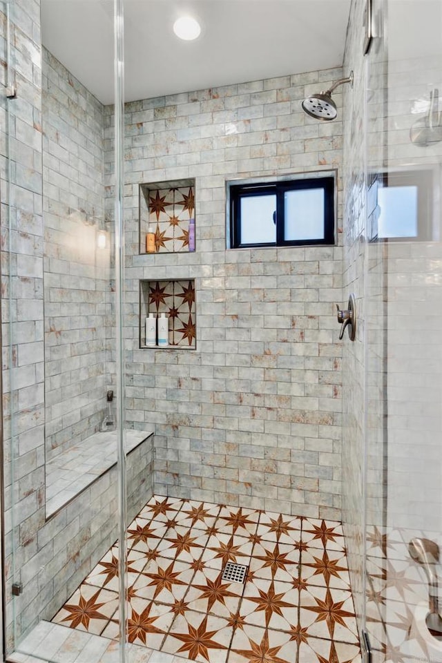 bathroom featuring an enclosed shower