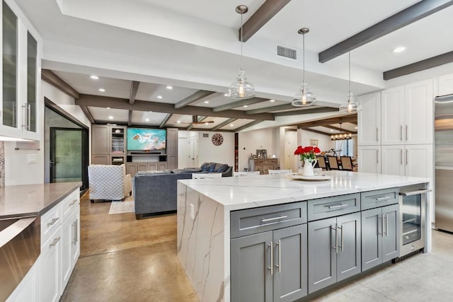 kitchen featuring pendant lighting, gray cabinetry, and white cabinets