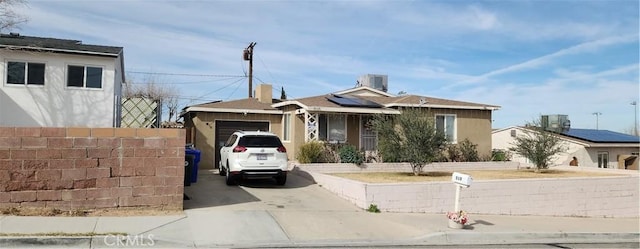 view of front of home with a garage and concrete driveway