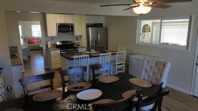 510 Adele Dr, Barstow, CA 92311 - dining room featuring ceiling fan and light wood finished floors