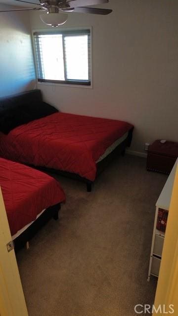 carpeted bedroom with a ceiling fan