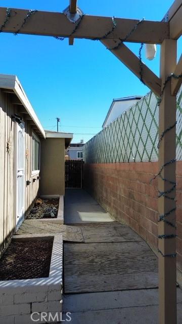 view of home's exterior with fence