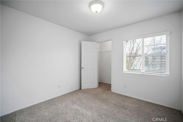 40241 Courtland Way, Temecula, CA 92591 - unfurnished bedroom with carpet, a walk in closet, and a closet