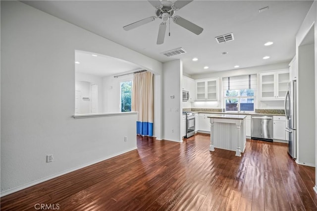 40241 Courtland Way, Temecula, CA 92591 - kitchen with stainless steel appliances, dark hardwood / wood-style flooring, a kitchen island, sink, and white cabinets