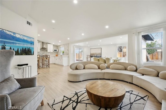 living room with light hardwood / wood-style floors