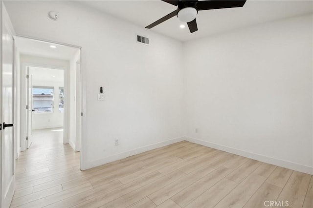 spare room featuring ceiling fan and light hardwood / wood-style floors