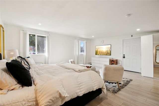 bedroom with light hardwood / wood-style flooring