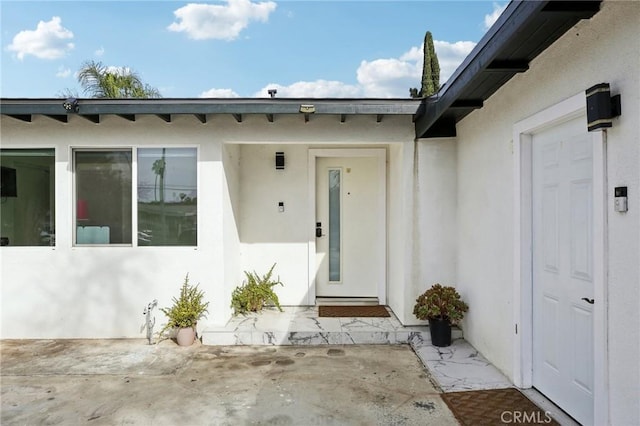 property entrance with a patio