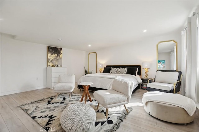 bedroom with light hardwood / wood-style floors