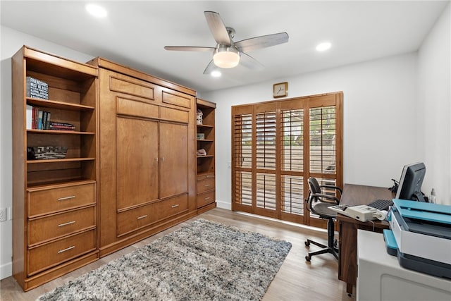 office area with light hardwood / wood-style flooring and ceiling fan