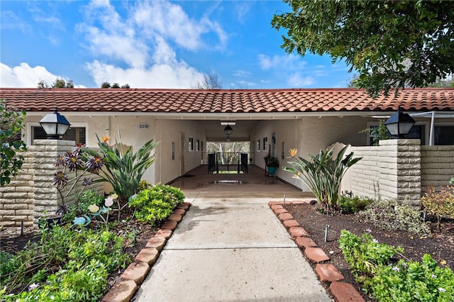 rear view of property featuring a carport