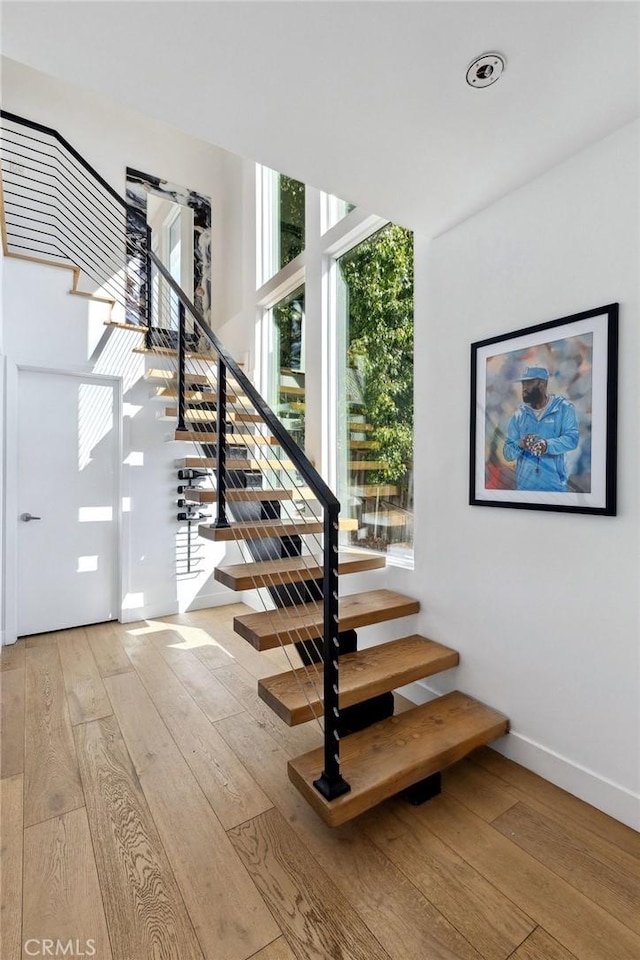 stairway featuring hardwood / wood-style floors