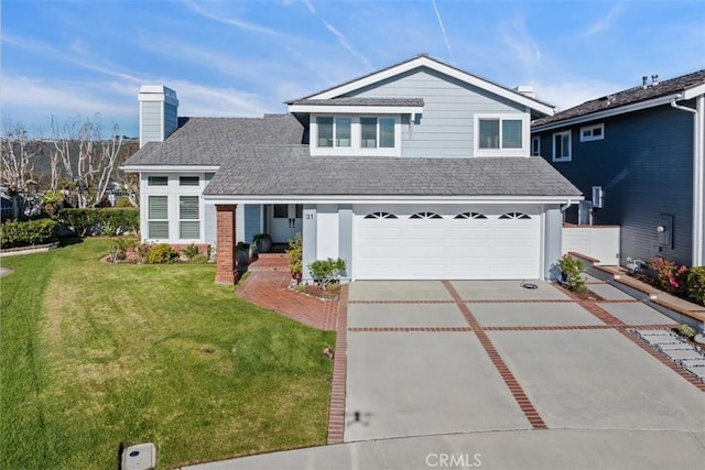 front of property featuring a front yard and a garage