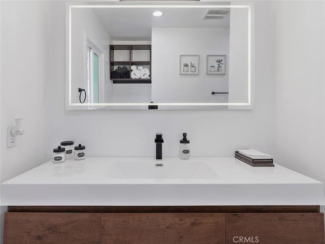 bathroom featuring visible vents and vanity