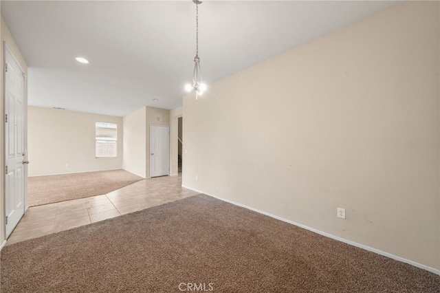 empty room featuring light carpet