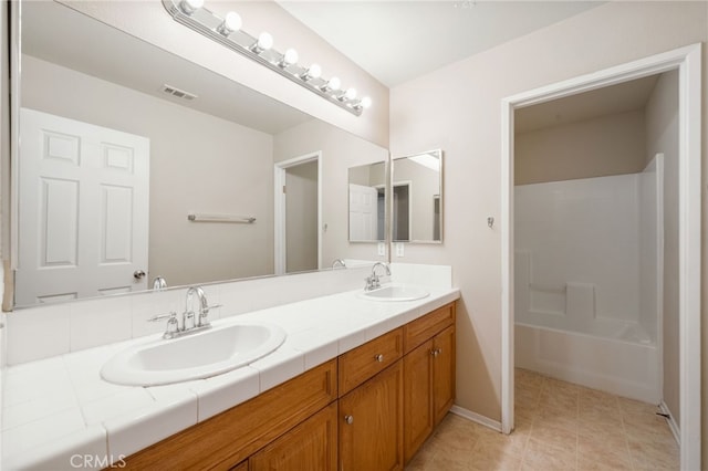 bathroom with vanity and tile patterned flooring