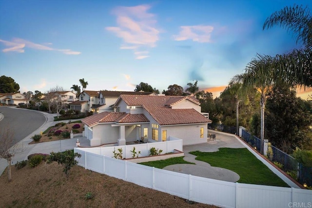 mediterranean / spanish-style house with a yard