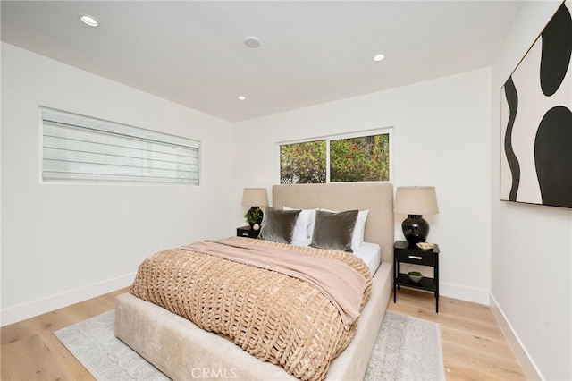 bedroom featuring light wood-style flooring, baseboards, and recessed lighting