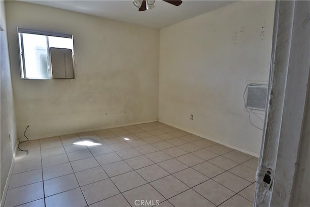 empty room featuring a ceiling fan and light tile patterned flooring
