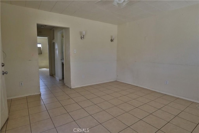 empty room with light tile patterned floors