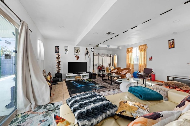 living room with light tile patterned flooring