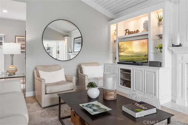 living room featuring vaulted ceiling, built in shelves, and wooden ceiling