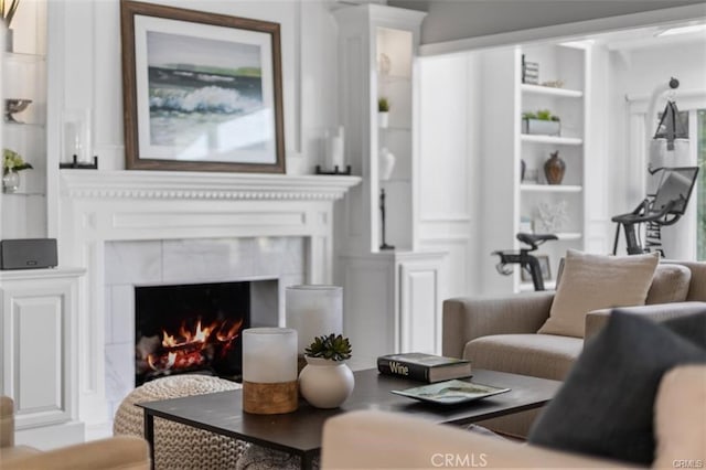 sitting room featuring a tile fireplace