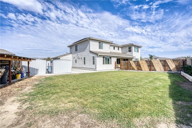 view of front of house featuring a front lawn and a patio area