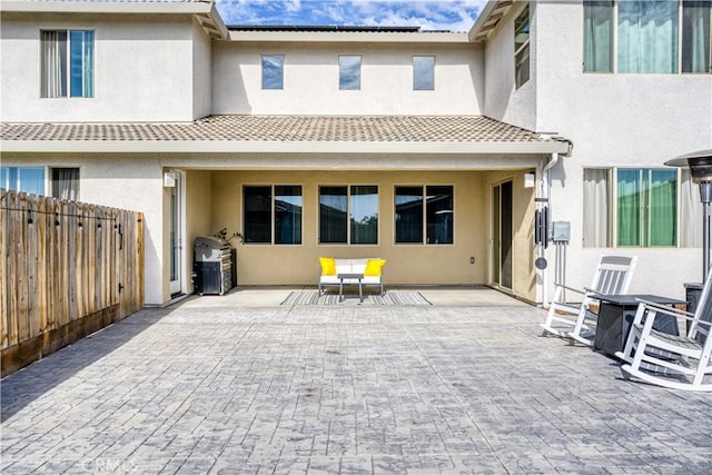 back of house featuring a patio area