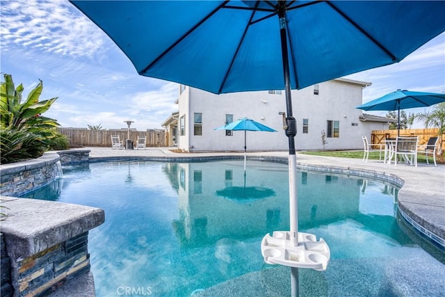 view of pool featuring a patio and pool water feature