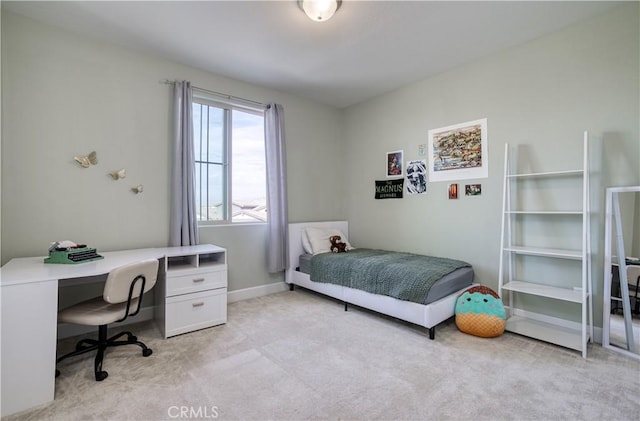 bedroom featuring light colored carpet