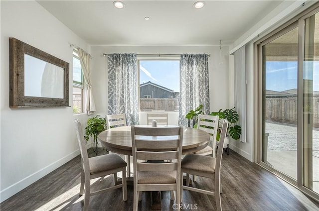 dining space featuring dark hardwood / wood-style floors