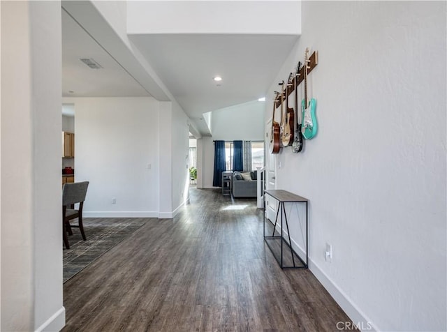 corridor featuring dark wood-type flooring