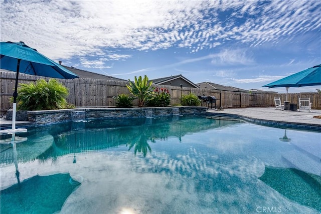 view of swimming pool featuring a patio and pool water feature