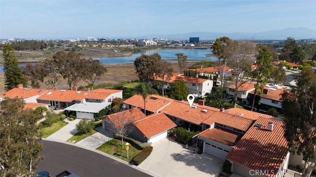 birds eye view of property featuring a residential view and a water view