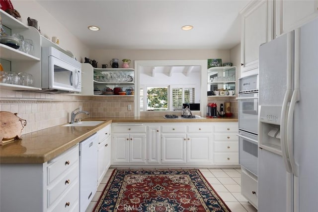 kitchen featuring white cabinets, light countertops, open shelves, light tile patterned floors, and white appliances