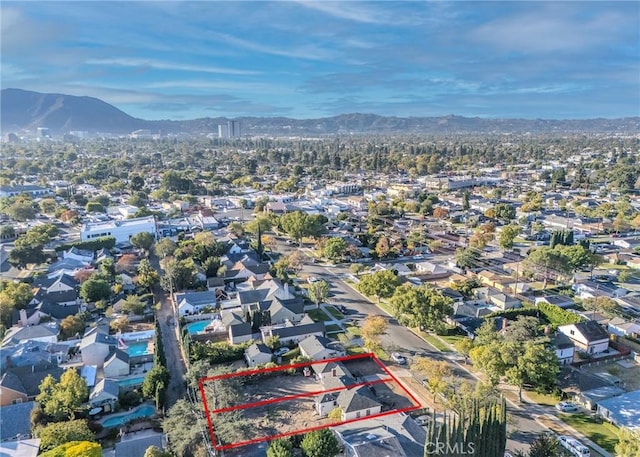 birds eye view of property featuring a mountain view