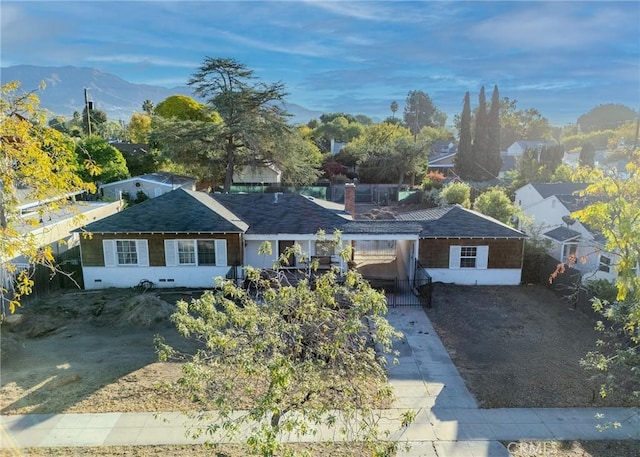 single story home featuring a mountain view