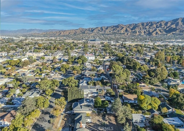 birds eye view of property with a mountain view