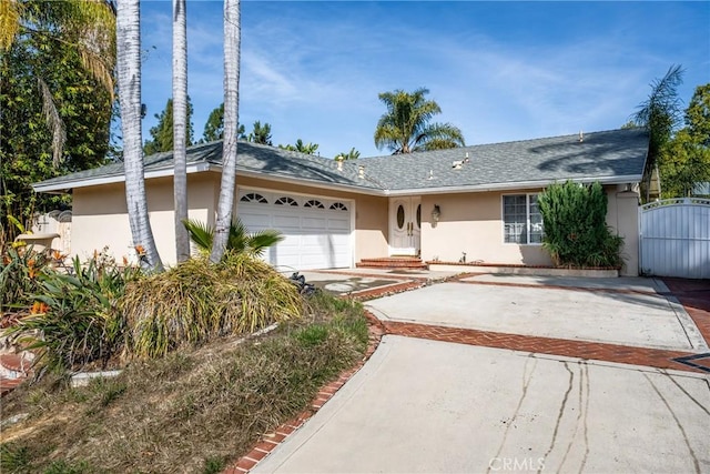 ranch-style house featuring a garage