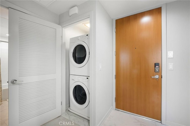 clothes washing area with stacked washer / drying machine