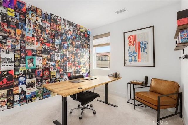 carpeted home office with baseboards and visible vents