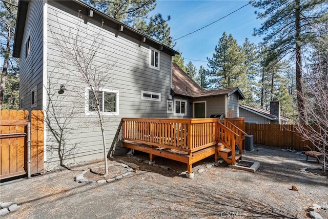 1707 Twin Lakes Dr, Wrightwood, CA 92397 - rear view of house featuring fence, a deck, and central AC unit
