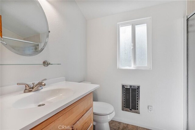 1707 Twin Lakes Dr, Wrightwood, CA 92397 - bathroom with vanity, vaulted ceiling, toilet, a shower, and tile patterned floors