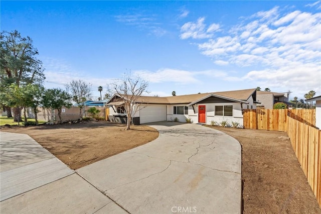 ranch-style home featuring a garage