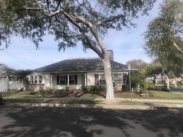 single story home with a chimney