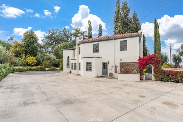 1205 W Highland Ave, Redlands, CA 92373 - back of property featuring a tiled roof and stucco siding