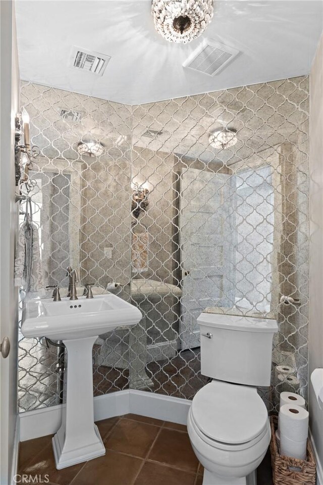 1205 W Highland Ave, Redlands, CA 92373 - half bath with tile patterned flooring, toilet, and baseboards